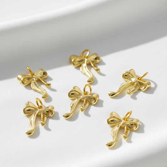 Golden Bow Charm – Mini Ribbon Pendant
