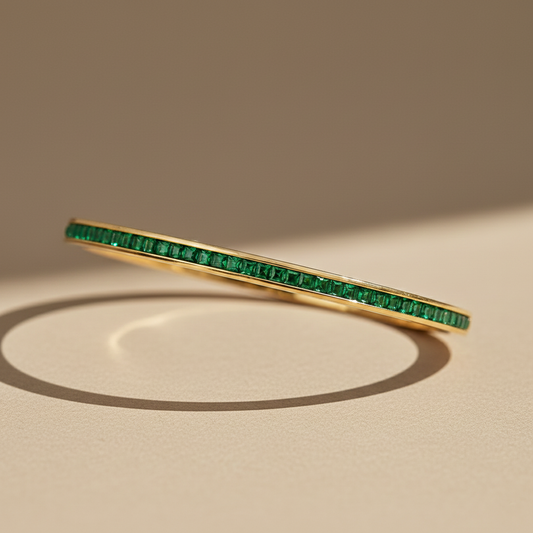 Gold Bangle Bracelet with Emerald-Green Stones