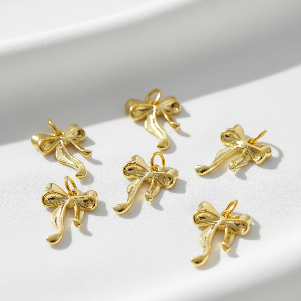 Golden Bow Charm – Mini Ribbon Pendant