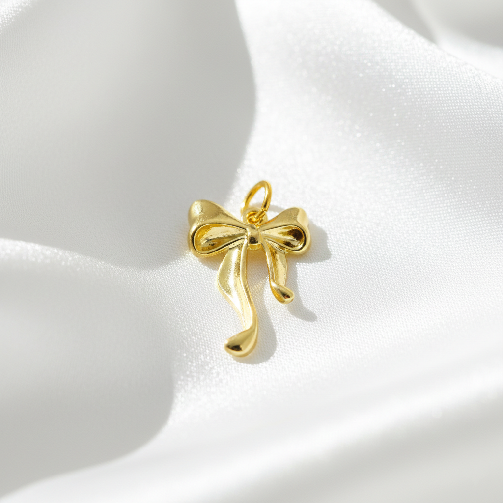 Golden Bow Charm – Mini Ribbon Pendant